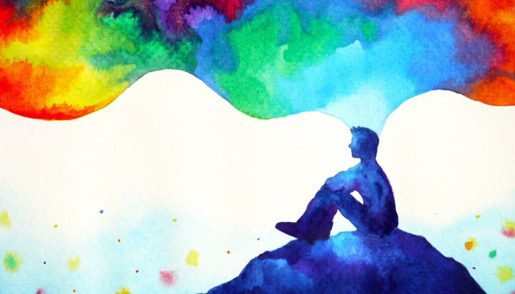 Person sitting on a hill, thinking in colour